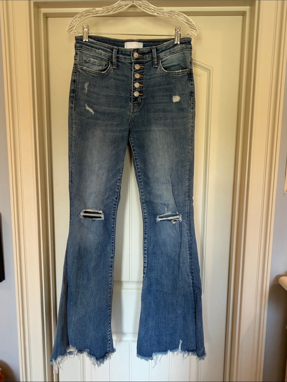 High-Rise Distressed Flare Jeans in Medium Blue